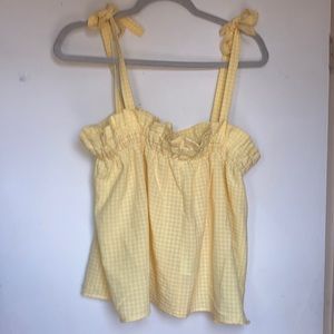 Yellow flowy blouse with ties on the shoulder